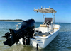 high-performance 19-foot fishing boat with 50HP outboard engine, deep V hull cutting through water for smooth ride